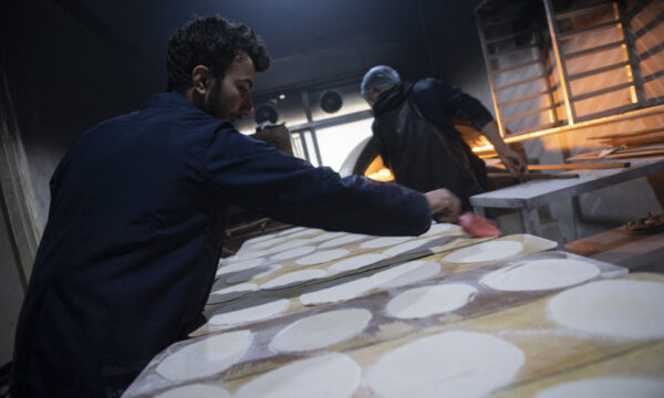 bakery workers while they are preparing the bread for the meals who will distribute to the people affected by the earthquake Feb 17,2023 Aleppo Syria