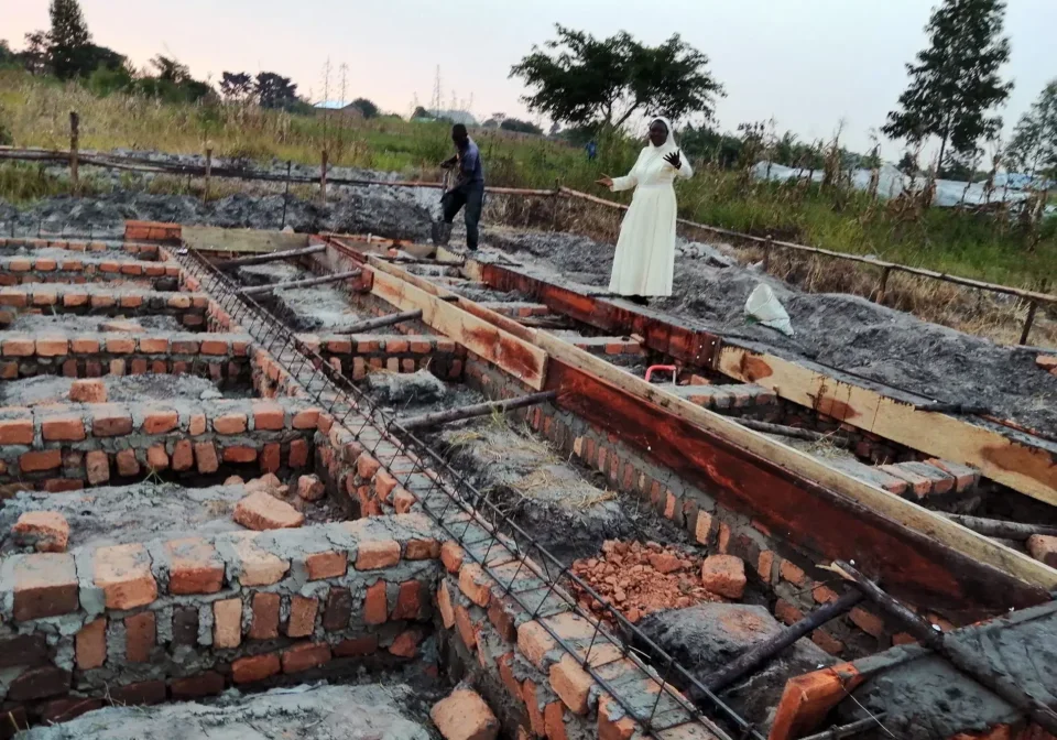 Sister-Salome-inspecting-the-setting-of-firm-concrete-foundation-for-the-school-toilets-and-bathrooms